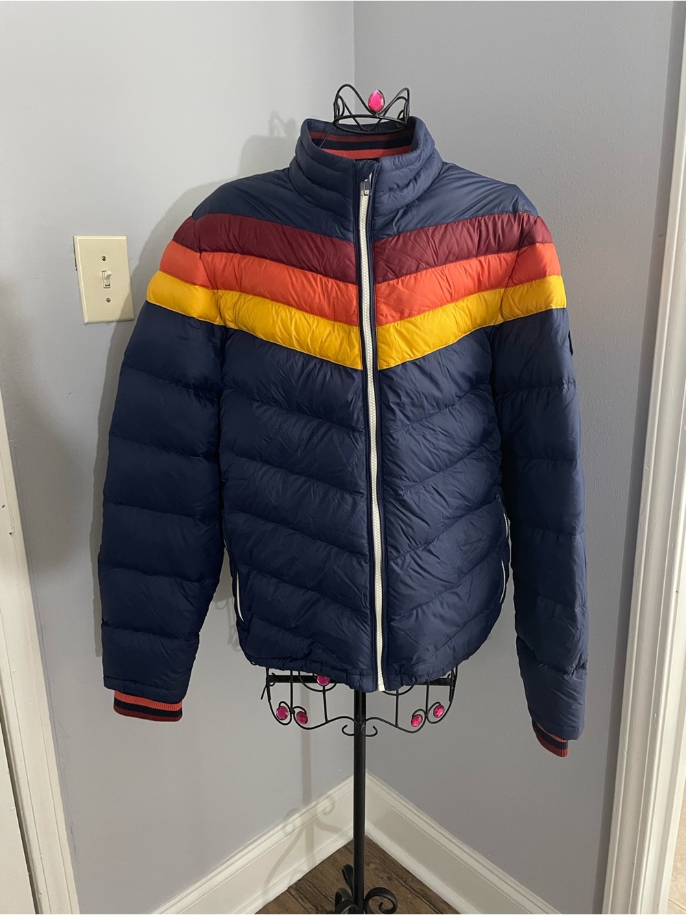 Marine Layer Navy Puffer Jacket with Red, Orange & Yellow Chevron